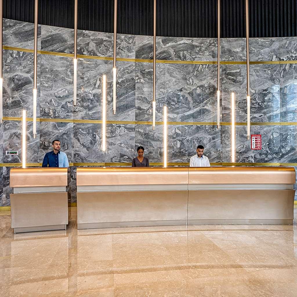 Hotel The First Collection Dubai Business Bay Interno foto Reception desk